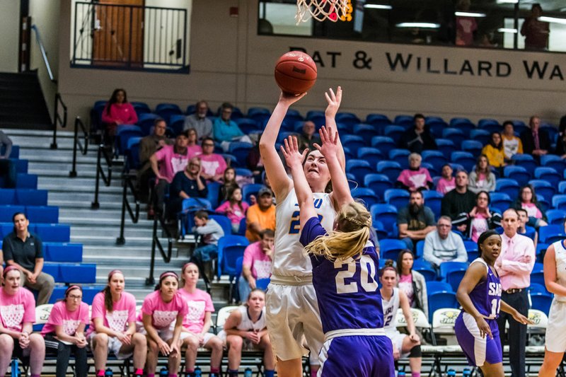 Courtesy of JBU Sports Information John Brown University's Ally Teague elevates above Southwestern Assemblies of God's Lexi Rich for a shot during the Golden Eagles' 78-67 loss at Bill George Arena on Thursday.