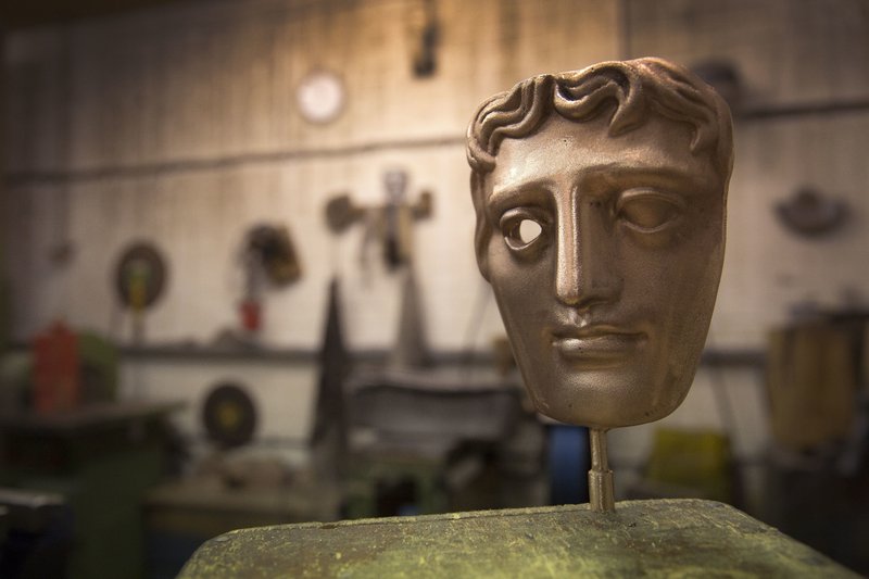  In this Tuesday, Jan. 31, 2017 file photo, a bronze alloy BAFTA mask stands in a foundry in West Drayton, London, ahead of the award ceremony in February. Designed by US sculptor Mitzi Cunliffe in 1955, New Pro Foundries has been making the bronze casts since the ceremony was created in 1976. The red carpet will be a sea of black as the movement against sexual misconduct takes center stage at the British Academy Film Awards on Sunday Feb. 18, 2018. 