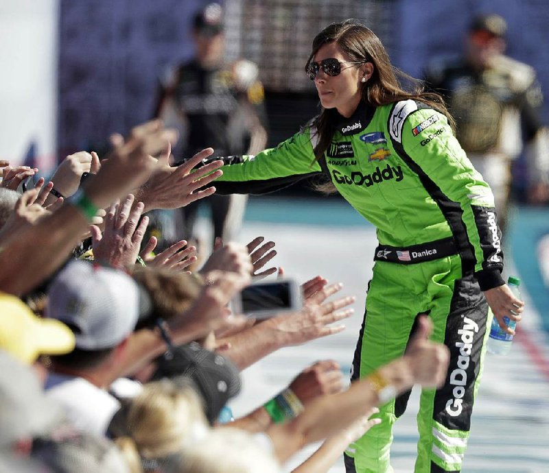 Danica Patrick greets fans as she is introduced before the Daytona 500. Patrick’s race was cut short after 101 laps because of a wreck.