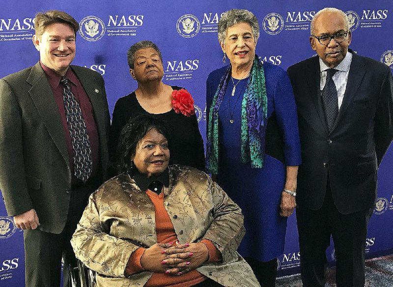 Arkansas Secretary of State Mark Martin (back, left) poses Sunday with members of the Little Rock Nine Elizabeth Eckford (left center), Carlotta Walls LaNier and Ernest Green, and Melba Pattillo Beals (front) in Washington, D.C. The four members of the Little Rock Nine received an award from the National Association of Secretaries of State. Martin had nominated them.

