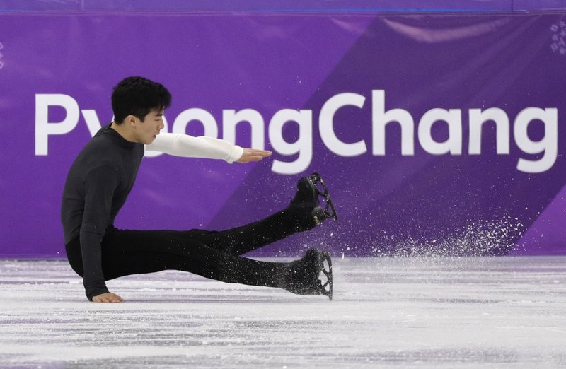 Nathan Chen of the United States falls while performing during the men's short program figure skating in the Gangneung Ice Arena at the 2018 Winter Olympics in Gangneung, South Korea, Friday, Feb. 16, 2018. (AP Photo/David J. Phillip)