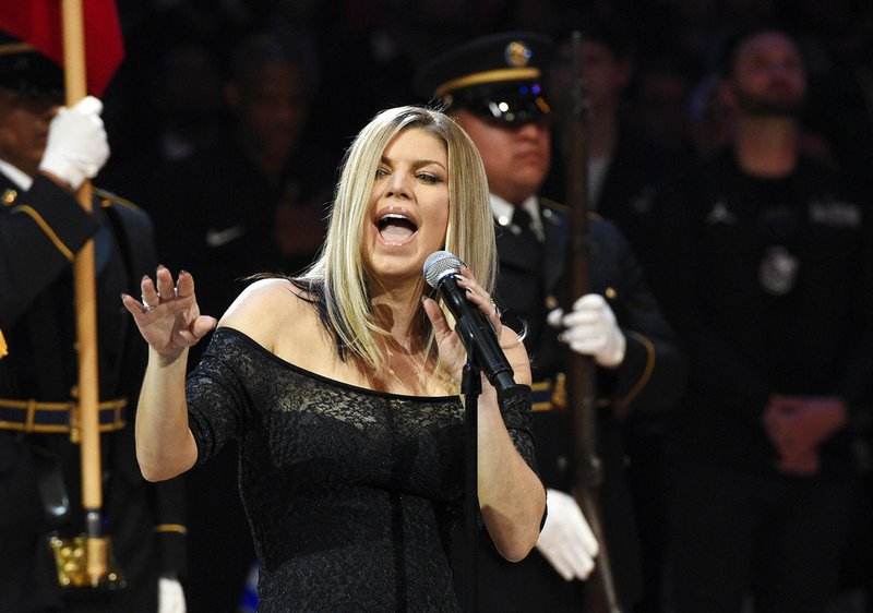 Singer Fergie performs the national anthem prior to an NBA All-Star basketball game, Sunday, Feb. 18, 2018, in Los Angeles.