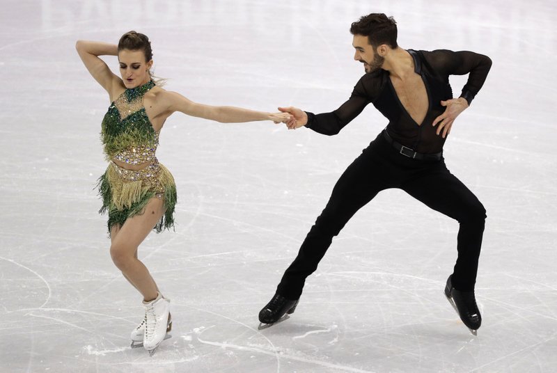 Gabriella Papadakis and Guillaume Cizeron of France perform during the ice dance, short dance figure skating in the Gangneung Ice Arena at the 2018 Winter Olympics in Gangneung, South Korea, Monday, Feb. 19, 2018. (AP Photo/David J. Phillip)

