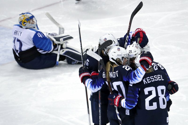 Players from the United States celebrate after Dani Cameranesi (24), of the United States, scores a goal against Finland during the third period of the semifinal round of the women's hockey game at the 2018 Winter Olympics in Gangneung, South Korea, Monday, Feb. 19, 2018. 