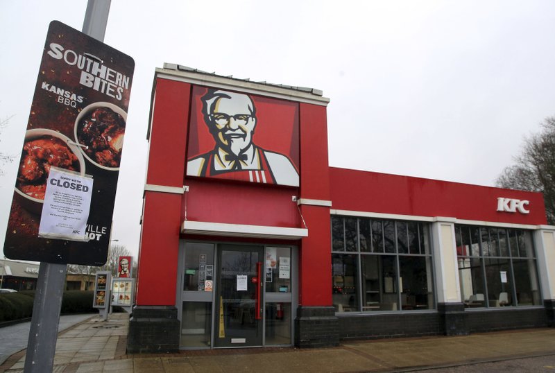 A closed sign is seen outside a KFC restaurant near Ashford, England, Monday, Feb. 19, 2018. Fast-food chain KFC has been forced to close most of its 900 outlets in Britain and Ireland because of a shortage of chicken The company is blaming "teething problems" with its new delivery partner, DHL. The company first apologized for the problems on Saturday. In an update Monday, it listed more than 200 stores as open, but did not say when the rest might reopen. (Gareth Fuller/PA via AP

