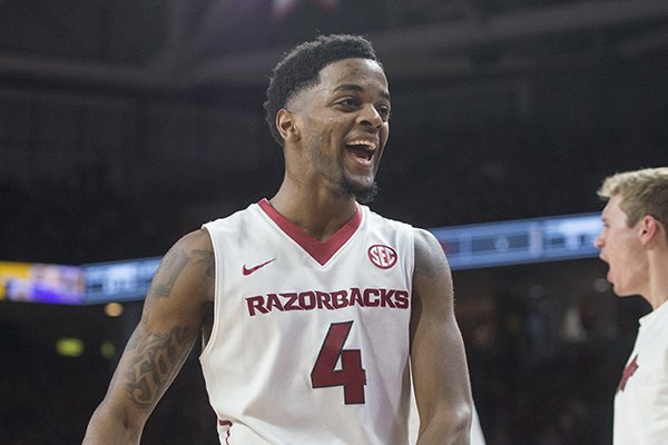 Daryl Macon of Arkansas reacts after an Arkansas teammate dunked against Texas A&M in the second half Saturday, Feb. 17, 2018, during the game at Bud Walton Arena in Fayetteville.