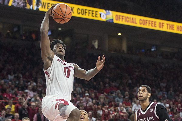 Jaylen Barford of Arkansas jumps for a dunk in the second half against Texas A&M Saturday, Feb. 17, 2018, during the game at Bud Walton Arena in Fayetteville.