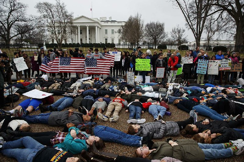 Demonstrators who support stronger gun-control laws participate in a “lie-in” in front of the White House on Monday in Washington.
