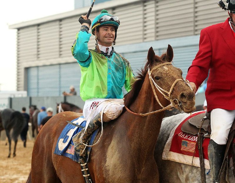 Jockey Corey Lanerie is led back on Hawaakom after winning the across the $500,000 Grade III Razorback Handicap at Oaklawn Park Monday, February 19, 2018.