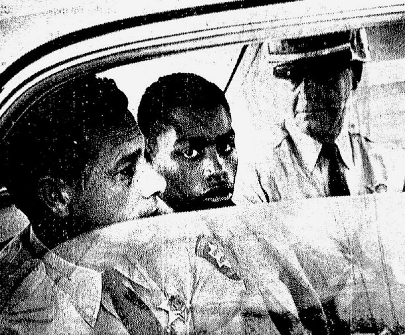 In this February 1964 file photo, Henry Montgomery is flanked by two deputies as he awaits the verdict in his trial for the slaying of Louisiana sheriff’s Deputy Charles Hurt.