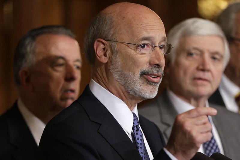 FILE - In this Oct. 7, 2015, file photo, Pennsylvania Gov. Tom Wolf, center, accompanied by state House Minority Leader Rep. Frank Dermody, right, D-Allegheny, and state Rep. Joe Markosek, left, D-Allegheny, discuss state budget negotiations at the state Capitol in Harrisburg, Pa. Pennsylvania's high court issued a new congressional district map for the state's 2018 elections on its self-imposed deadline Monday, Feb. 19, 2018, all but ensuring that Democratic prospects will improve in several seats and that Republican lawmakers challenge it in federal court. The map of Pennsylvania's 18 congressional districts is to be in effect for the May 15 primary and substantially overhauls a congressional map widely viewed as among the nation's most gerrymandered. The map was approved in a 4-3 decision. (AP Photo/Matt Rourke, File)