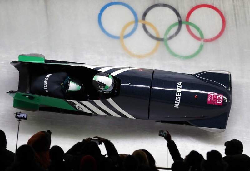 Driver Seun Adigun and Akuoma Omeoga of Nigeria take a curve in their first heat during the women's two-man bobsled competition at the 2018 Winter Olympics in Pyeongchang, South Korea, Tuesday, Feb. 20, 2018.