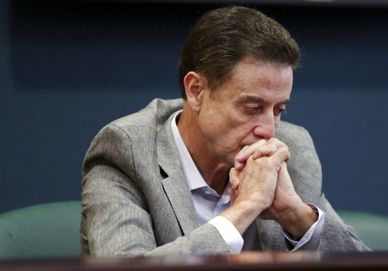 In this June 15, 2017, file photo, Louisville basketball coach Rick Pitino listens during an NCAA college basketball news conference in Louisville, Ky. Louisville must vacate its 2013 men’s basketball title following an NCAA appeals panel’s decision to uphold sanctions against the men’s program for violations committed in a sex scandal. The Cardinals will have to vacate 123 victories including the championship, and return millions in postseason revenue. The decision announced on Tuesday, Feb. 20, 2018, by the governing body’s Infraction Appeals Committee ruled that the NCAA has the authority to take away championships for what it considers major rule violations.