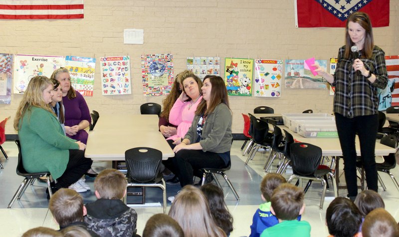 Photo Submitted Kindergarten teachers at Glenn Duffy Elementary School participate in the school's February Rise and Shine assembly by modeling expectations of how students can be successful at waiting their turn. Teachers are Diana Cradduck (left), MaryJo Norberg, Kristy Sanders, Misty Arment, Autumn Phillips, Christina Hartman and Teresa Spencer.