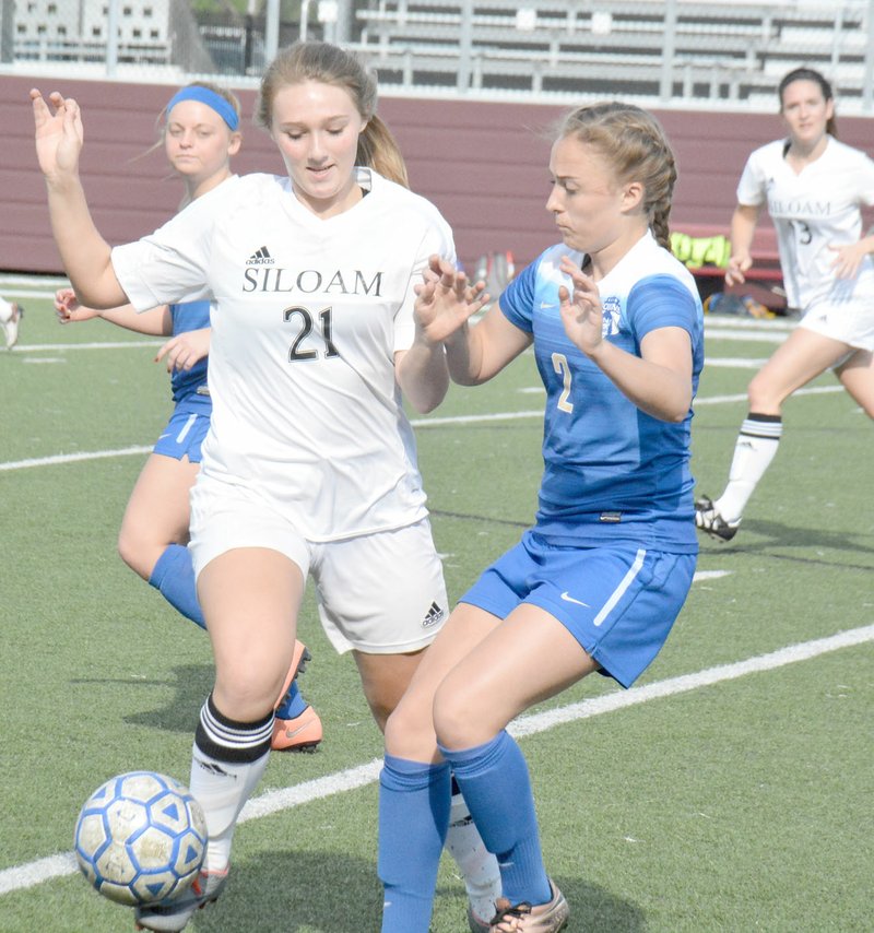 Graham Thomas/Herald-Leader Junior Hailey Dorsey fights for the ball with Harrison players during a game last season.