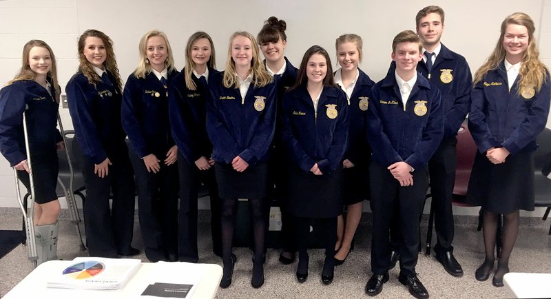 Westside Eagle Observer/RANDY MOLL Members of Gentry High School's FFA chapter attended the school board meeting on Monday and led board members and guests in the Pledge of Allegiance at the beginning of the meeting. Pictured are Brooke Blevins (front, left) Sadie Reece, Vernon McKirch, Josie Newsom (back, left), Karadie Ory, Bailee Ory, Kinley Hays, Allee Sweeten, Taylor Norman, Brendon Atwood and Megan McCollum.