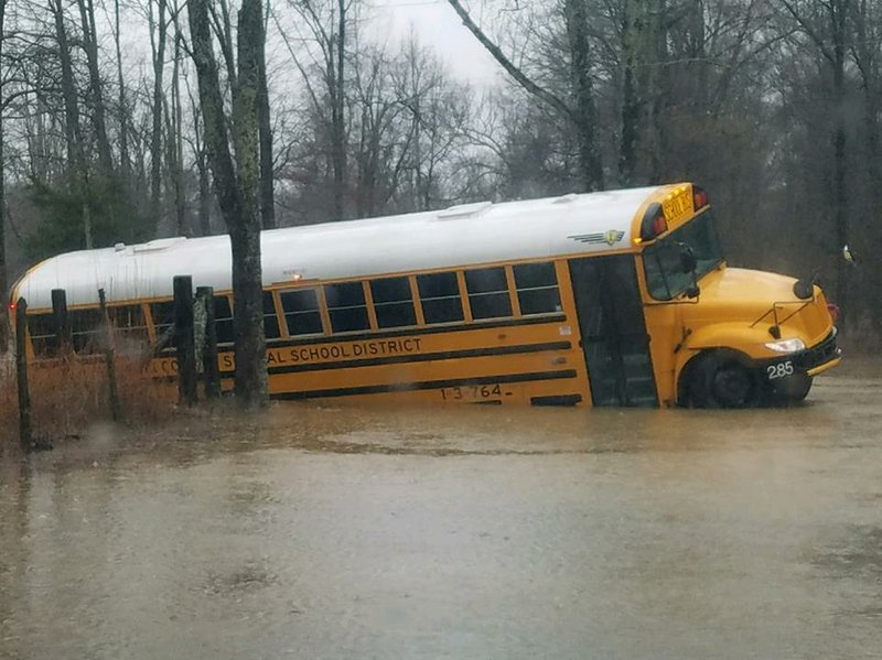 A Pulaski County school bus drove off a flooded road and got stuck Wednesday morning, authorities said.