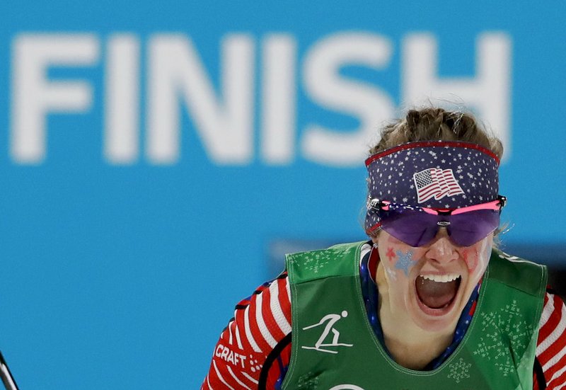 Jessica Diggins, of the United States, celebrates after winning the gold medal in the during women's team sprint freestyle cross-country skiing final at the 2018 Winter Olympics in Pyeongchang, South Korea, Wednesday, Feb. 21, 2018. 