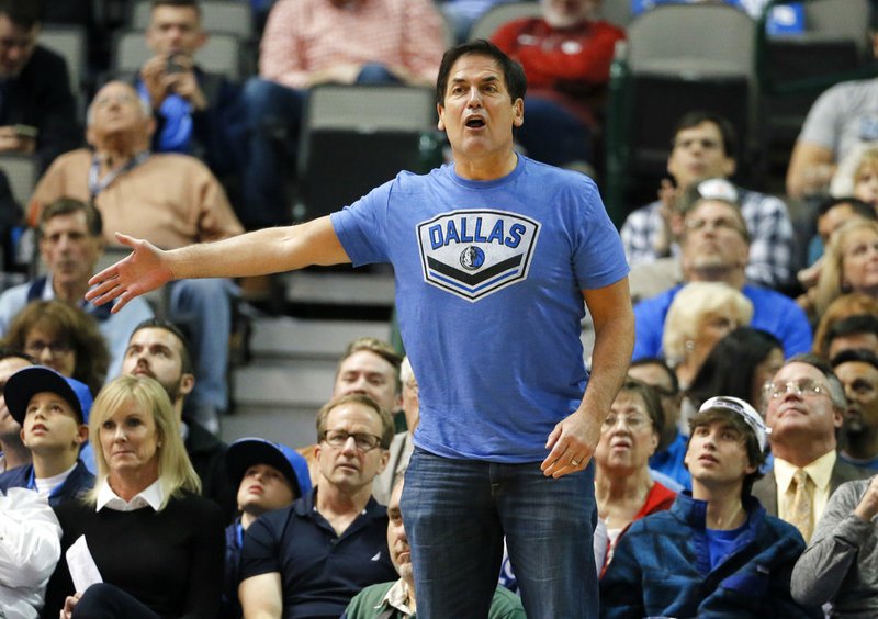In this Dec. 14, 2015, file photo, Dallas Mavericks team owner Mark Cuban shouts in the direction of an official during an NBA basketball game against the Phoenix Suns, in Dallas. 