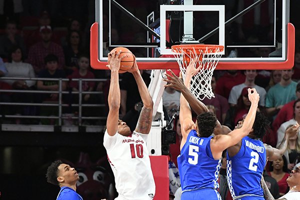 Arkansas' Daniel Gafford comes down with a rebound between Kentucky's P.J. Washington (left), Kevin Knox (5) and Jarred Vanderbilt (2) Tuesday Feb. 20, 2018 during the first half at Bud Walton Arena in Fayetteville.