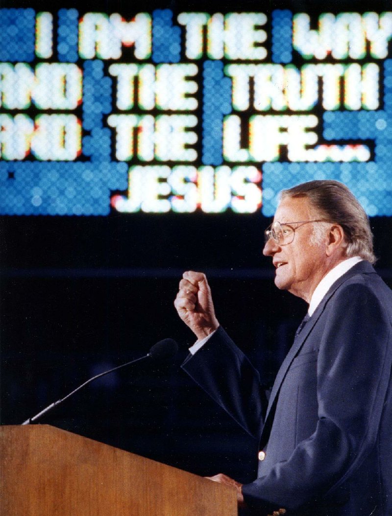 The Rev. Billy Graham speaks at a crusade at War Memorial Stadium in Little Rock in 1989. Graham, who died Wednesday at the age of 99, became a spiritual leader for millions at home and around the world. 