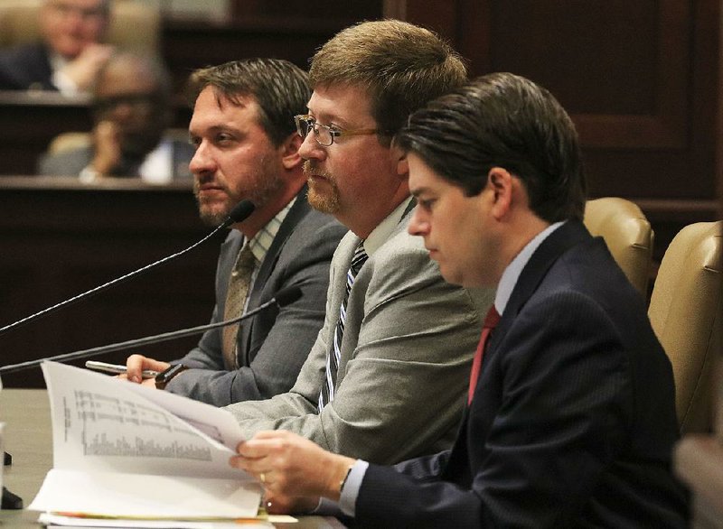 State Education Commissioner Johnny Key (center) is shown in this file photo with Greg Rogers (left), the department’s assistant commissioner for fiscal and administrative services, and Duncan Baird, state budget administrator. 