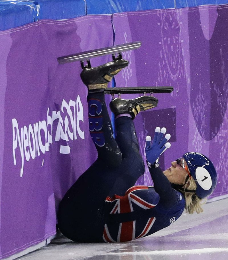 Britain’s Elise Christie saw her Olympic troubles continue in short track speedskating with more crashes and disqualifications.