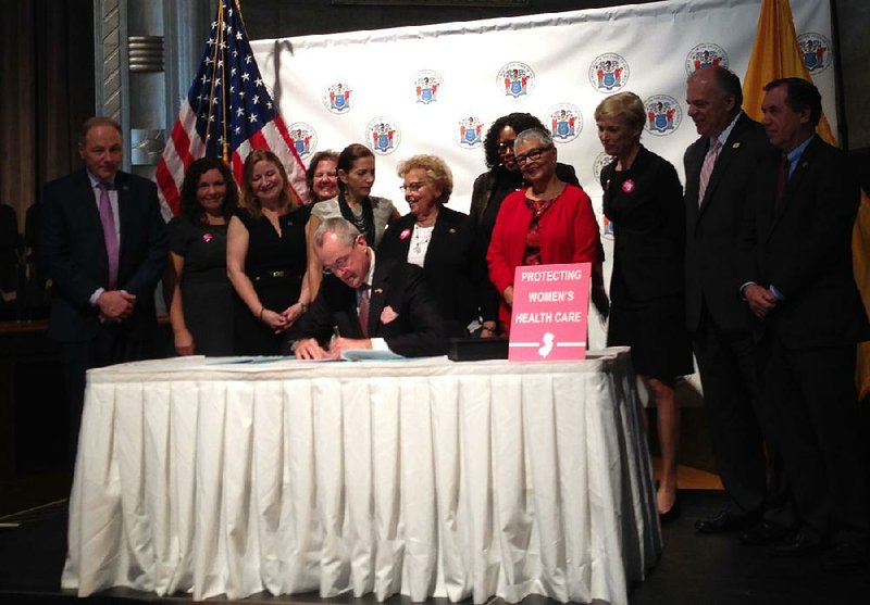 New Jersey Gov. Phil Murphy, a Democrat, signs legislation Wednesday in Trenton to fund family-planning services, saying “New Jersey will once again stand up for women’s health.”  