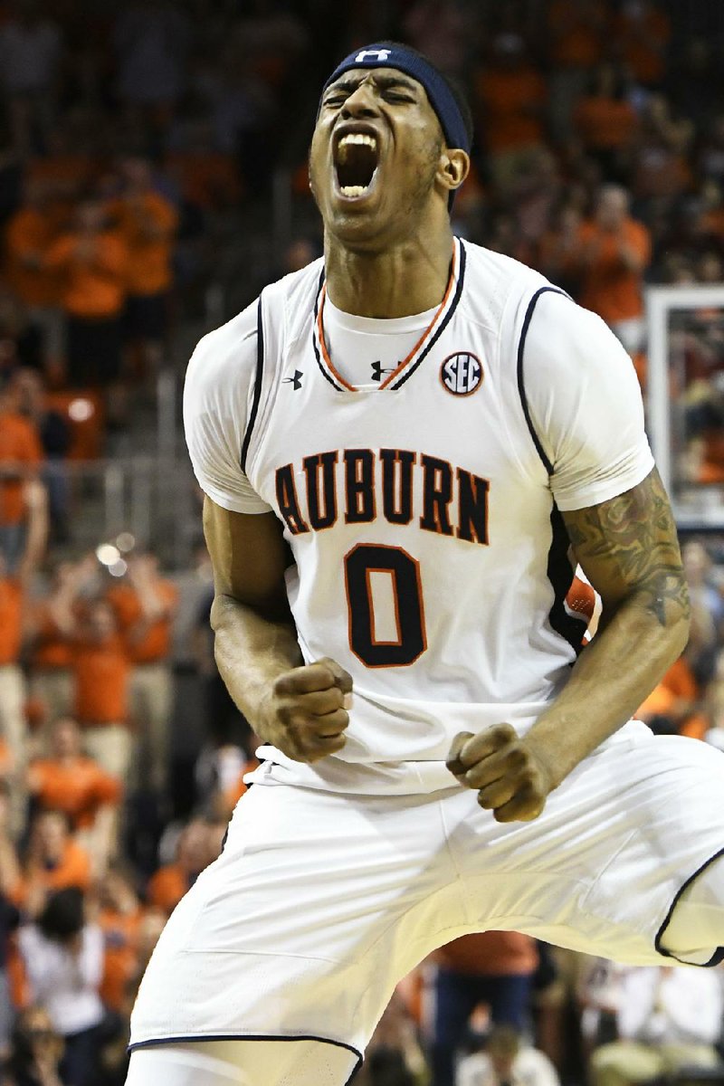 Auburn’s Horace Spencer reacts after a three-pointer during the Tigers’ victory over Alabama on Wednesday night. 