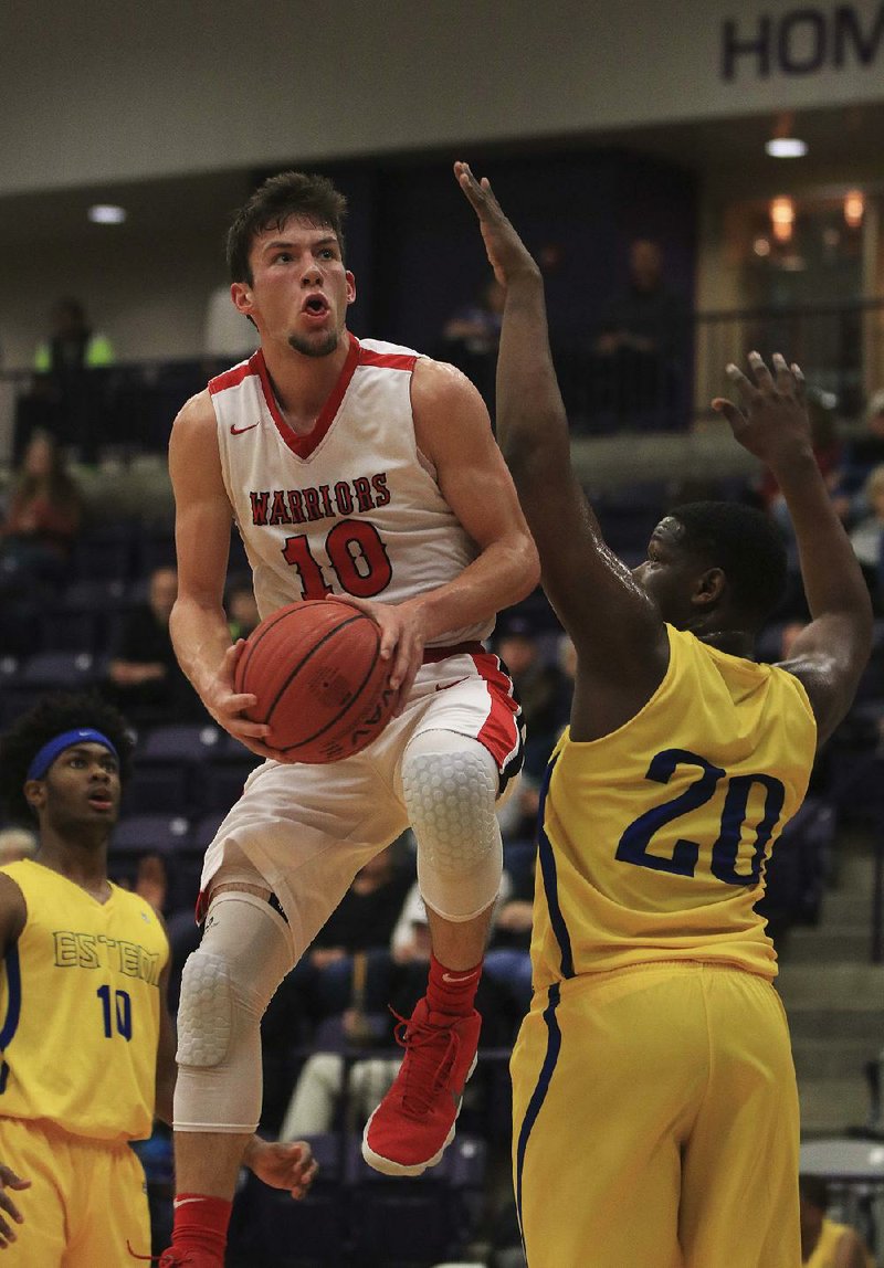 Jonesboro Westside’s Avery Felts (10) drives to the basket against eStem defender Laityn Sheppard during the Warriors’ 71-55 victory over the Mets on Wednesday at the Class 4A-East Region tournament in Lonoke. The junior guard finished with 33 points, 10 rebounds, 9 assists and 5 steals. 