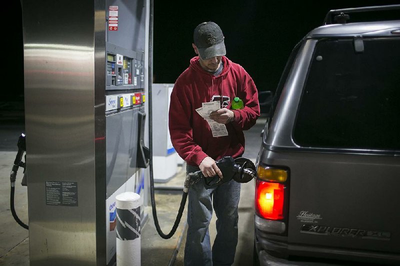 A customer pumps fuel in Eastanollee, Ga., in January. Conservative groups affiliated with the Koch brothers’ political network are ramping up opposition to raising the federal gasoline tax, an idea floated recently by President Donald Trump.  
