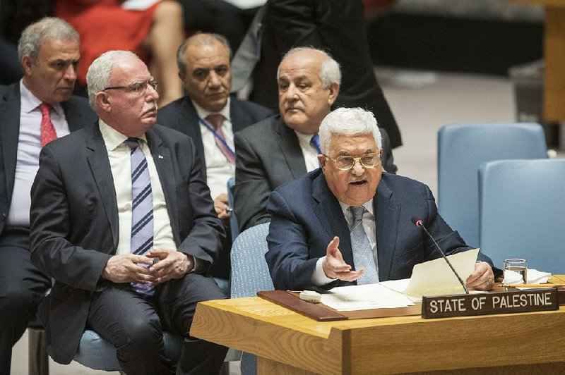Palestinian President Mahmoud Abbas urges the Security Council on Tuesday at U.N. headquarters to call for an international conference on a Middle East accord. 