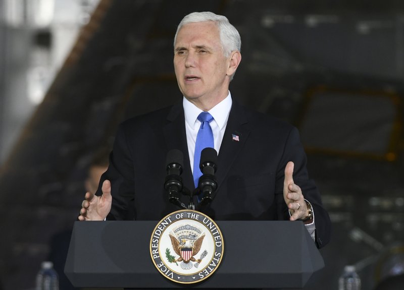 Vice President Mike Pence addresses the audience during a meeting of the National Space Council, Wednesday, Feb. 21, 2018, at Kennedy Space Center in Cape Canaveral, Fla. Pence convened the meeting Wednesday morning inside the building where NASA once prepped pieces of the International Space Station. (Craig Bailey/Florida Today via AP)