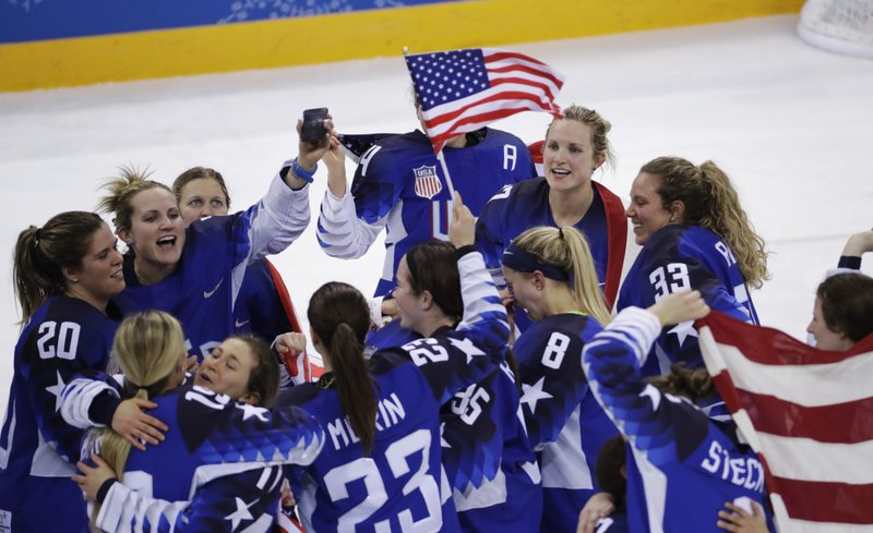 United States celebrates winning gold after the women's gold medal hockey game against Canada at the 2018 Winter Olympics in Gangneung, South Korea, Thursday, Feb. 22, 2018. (AP Photo/Matt Slocum)

