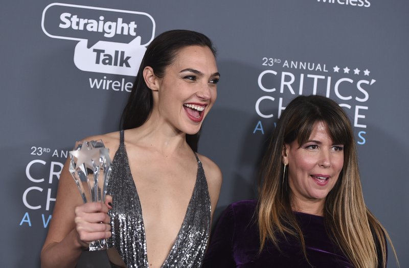 In this Jan. 11, 2018 file photo, Gal Gadot, left, and Patty Jenkins, winners of the award for best action movie for "Wonder Woman", pose in the press room at the 23rd annual Critics' Choice Awards at the Barker Hangar in Santa Monica, Calif. The Center for the Study of Women in Television and Film at San Diego State University released its annual “It’s a Man’s (Celluloid) World” on Thursday, Feb. 22. . It found that females comprised 24 percent of protagonists last year, down from 29 percent in 2016 despite high-profile releases like “Star Wars: The Last Jedi” and “Beauty and the Beast” _ 2017’s top two films at the box office.