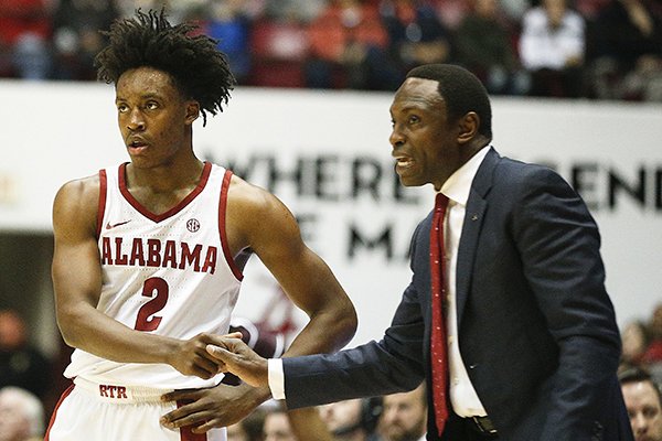 Alabama guard Collin Sexton shakes hands with Alabama head coach Avery Johnson during the second half of an NCAA college basketball game, Saturday, Dec. 30, 2017, in Tuscaloosa, Ala. (AP Photo/Brynn Anderson)