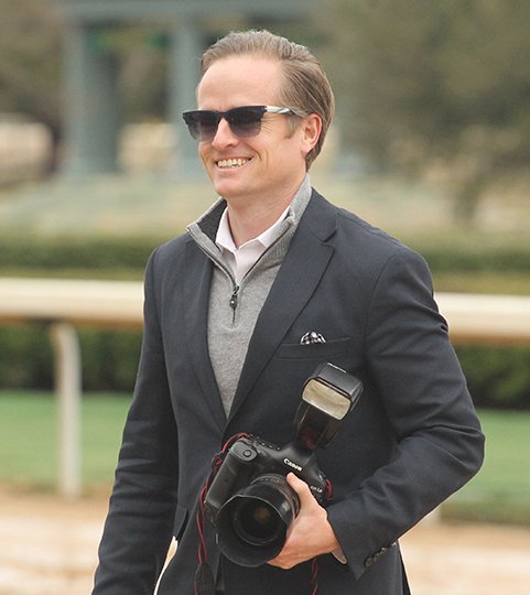 The Sentinel-Record/Richard Rasmussen GETTING THE SHOT: Oaklawn track photographer Kurtis Coady gets ready to take a win photo at Oaklawn Park on Saturday. Coady Photography, a business run by Coady and his brothers, is the official photographer of the Kentucky Derby.