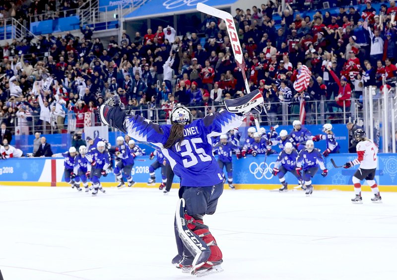 The United States players celebrate winning after the women's gold medal hockey game against Canada at the 2018 Winter Olympics in Gangneung, South Korea, Thursday, Feb. 22, 2018. (AP Photo/Frank Franklin II)