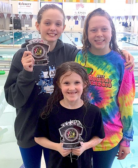 Submitted photo BATTLE BIDS: Aubrey Schmitt, front, won the high point award for the division for girls ages 8 and younger in last weekend's 2018 Battle for the Belt swimming meet in Benton. Emma Crowe , back left, earned the most points for the girls ages 11-12 division, while sectional qualifier Nicole Burek won all seven of her events. The trio combined to win 33 of the 35 events in which they entered, while taking second place in the other two.