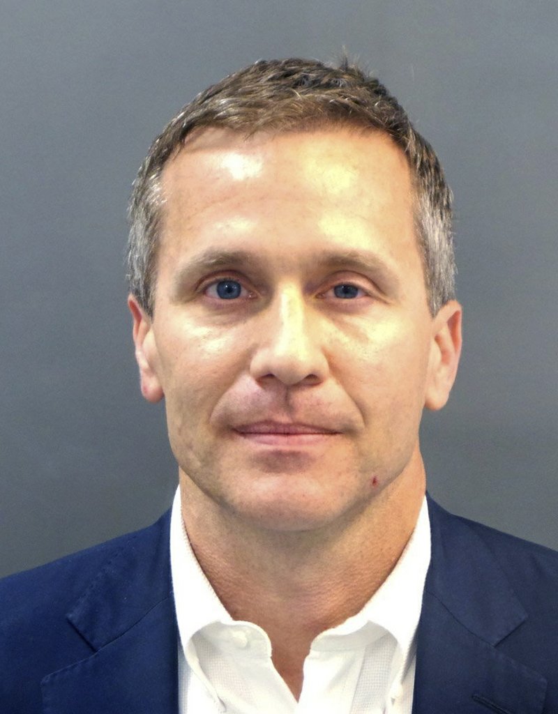 A booking photo provided by the St. Louis Metropolitan Police Department shows Missouri Gov. Eric Greitens on Thursday, Feb. 22, 2018. A St. Louis grand jury has indicted Greitens on a felony invasion of privacy charge for allegedly taking a compromising photo of a woman with whom he had an affair in 2015, the city circuit attorney's office said Thursday. Greitens' attorney issued a scathing statement challenging the indictment. (St. Louis Metropolitan Police Department/St. Louis Post-Dispatch via AP)