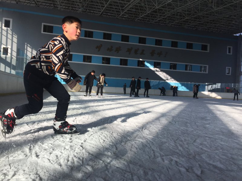 In this Feb. 1, 2018 photo, a North Korean boy enjoys a day off during winter break from school at the Indoor Skating Rink in Pyongyang, North Korea. Though not known for its prowess at winter sports, North Korea decided at the last minute to send a couple dozen athletes to the Pyeongchang Winter Olympics in South Korea. (AP Photo/Eric Talmadge)