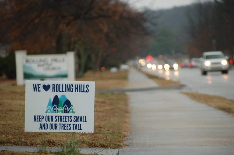 NWA Democrat-Gazette/STACY RYBURN A sign from a group pushing to maintain the character of Rolling Hills Drive and its surrounding neighborhoods in Fayetteville is seen Thursday. City officials hosted a discussion about the area with neighbors at Rolling Hills Baptist Church.