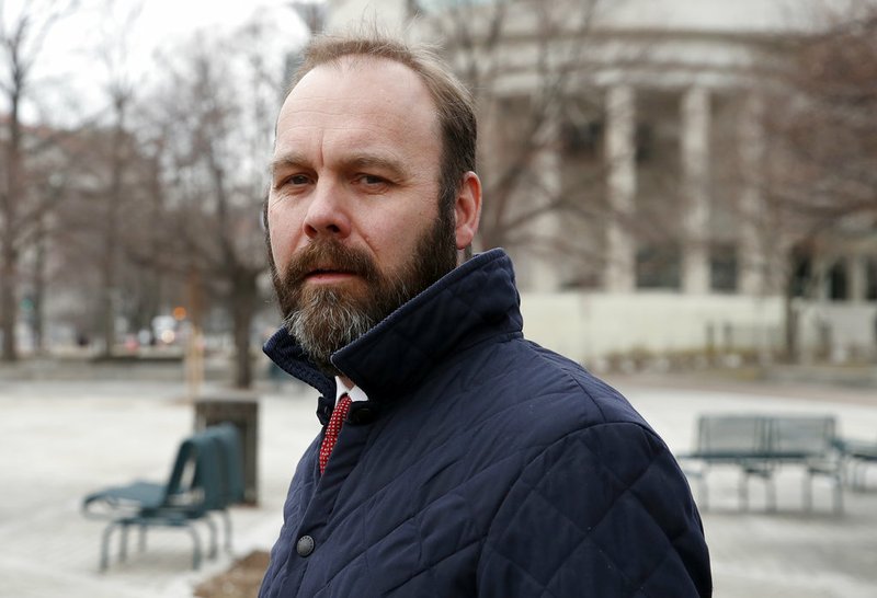 In this Feb. 14, 2018, file photo, Rick Gates departs Federal District Court in Washington. In a dramatic escalation of pressure and stakes, special counsel Robert Mueller filed additional criminal charges Thursday against President Donald Trump's former campaign chairman Paul Manafort and his business associate, Gates.