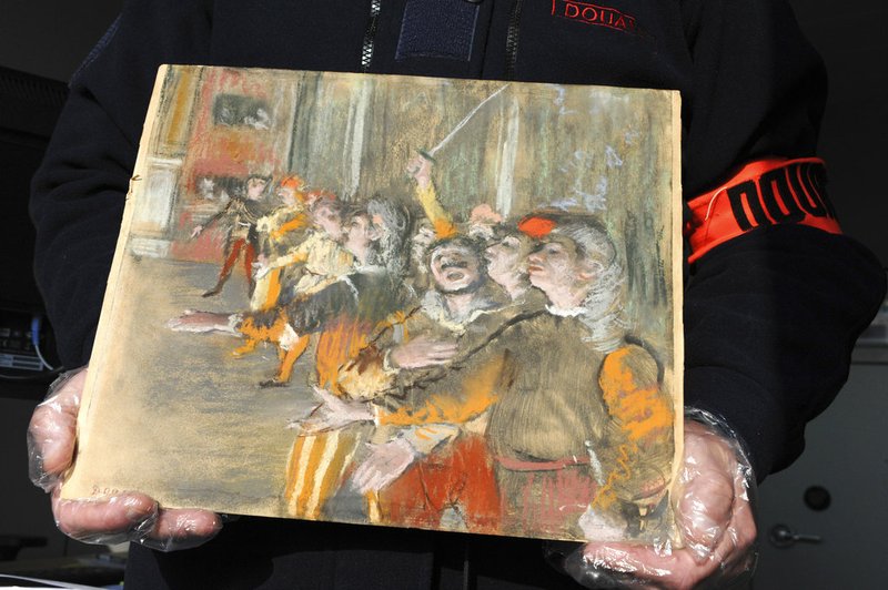 This photo taken Thursday Feb. 22, 2018 and provided by French Customs shows a stolen painting by French painter Edgar Degas. French customs have discovered an original Impressionist masterpiece by Edgar Degas 