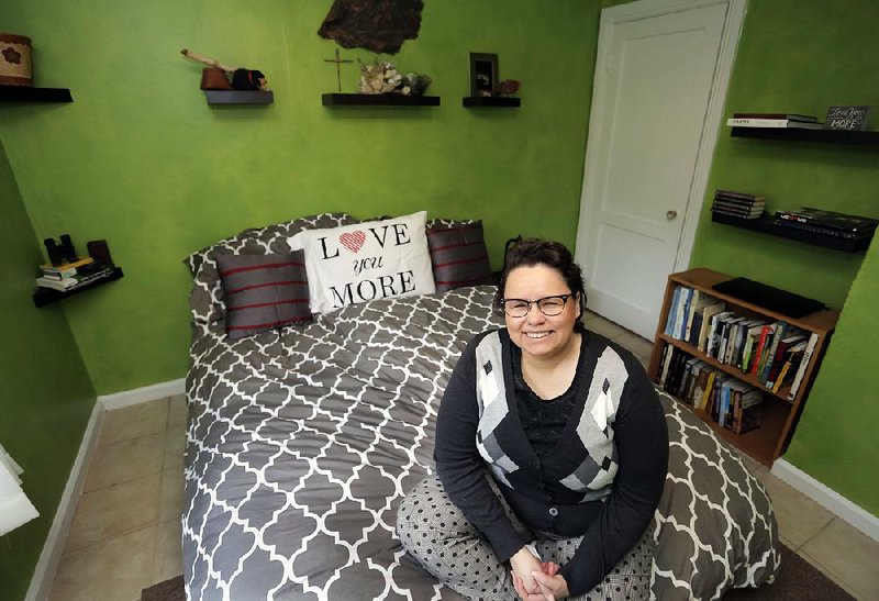 Justine Baker in her favorite place in her home, her bedroom.