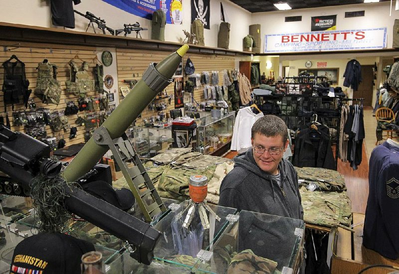 Andy Sadler of North Little Rock browses sale items Thursday at Bennett’s Military Supplies on Main Street in Little Rock. 