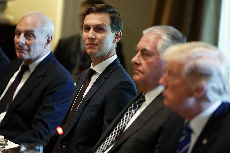 White House Chief of Staff John Kelly (from left) sits with White House senior adviser Jared Kushner, Secretary of State Rex Tillerson and President Donald Trump during a meeting Sept. 26. Deputy Attorney General Rod Rosenstein alerted the White House on Feb. 9 that the security clearance process for Kushner would be further delayed because of signifi cant information.