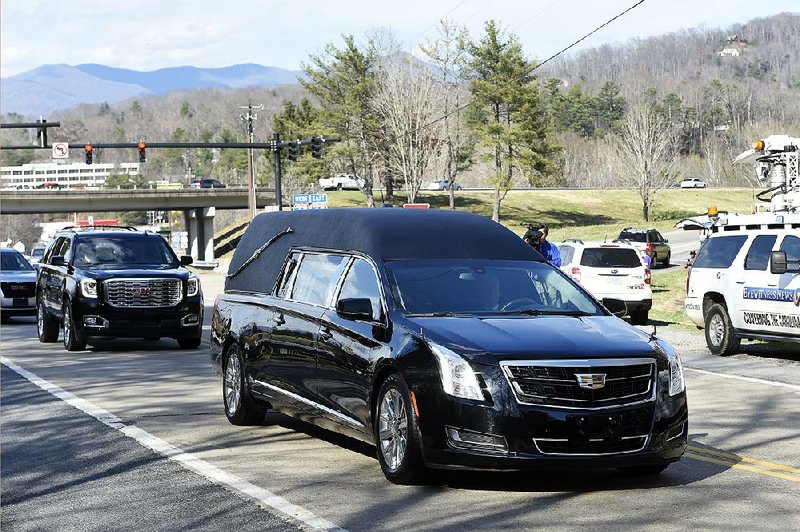 The hearse carrying the body of the Rev. Billy Graham arrives Thursday at the Billy Graham Training Center at the Cove in Asheville, N.C.
