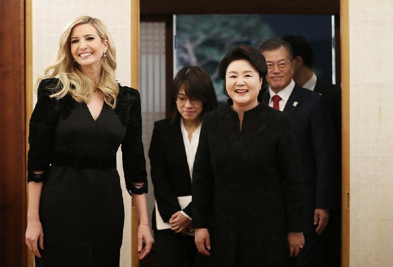 Ivanka Trump, daughter of President Donald Trump, arrives with South Korean President Moon Jaein and his wife, Kim Jung-sook, to attend a dinner Friday at the presidential Blue House in Seoul.