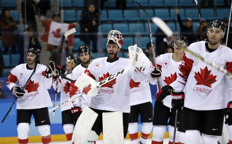  Goalie Kevin Poulin (31), of Canada, celebrates after the men's bronze medal hockey game against the Czech Republic at the 2018 Winter Olympics in Gangneung, South Korea, Saturday, Feb. 24, 2018. Canada won 6-4. 